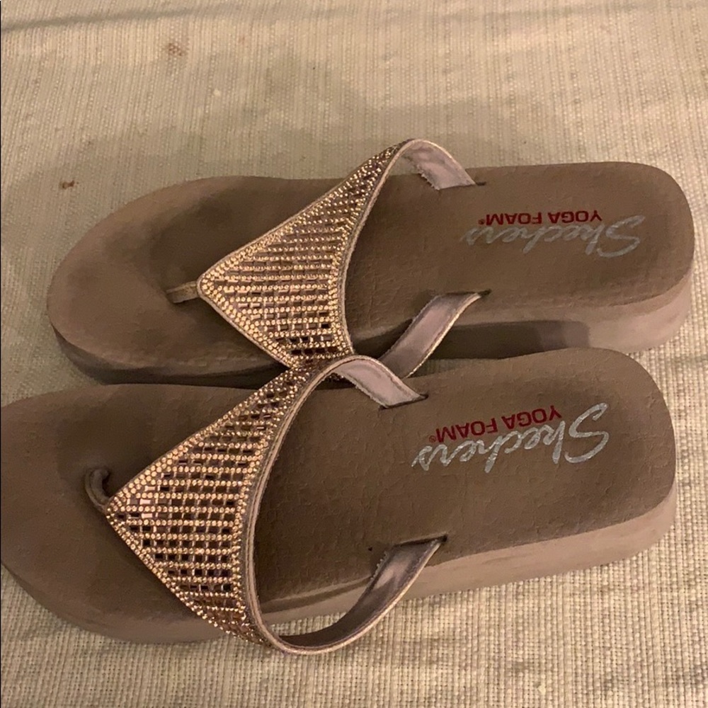Rose gold jeweled Skechers made of yoga foam.